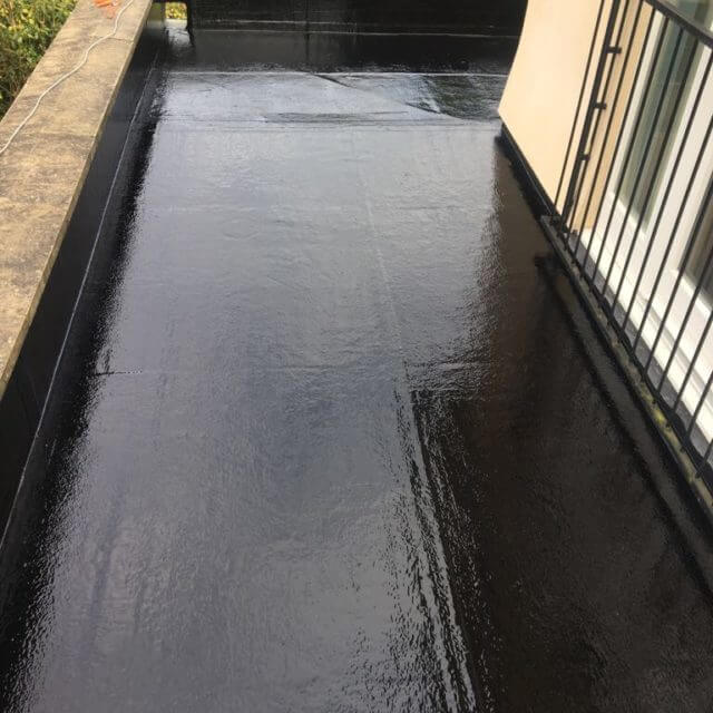 Fibre Glass Flat Roof with a railed off window on the right-hand side