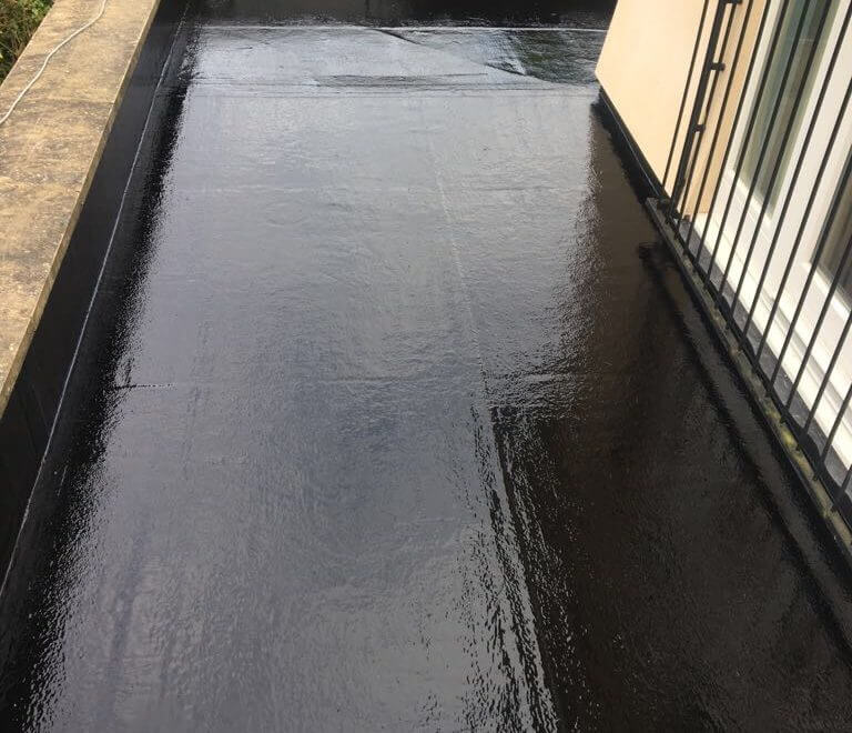 Fibre Glass Flat Roof with a railed off window on the right-hand side